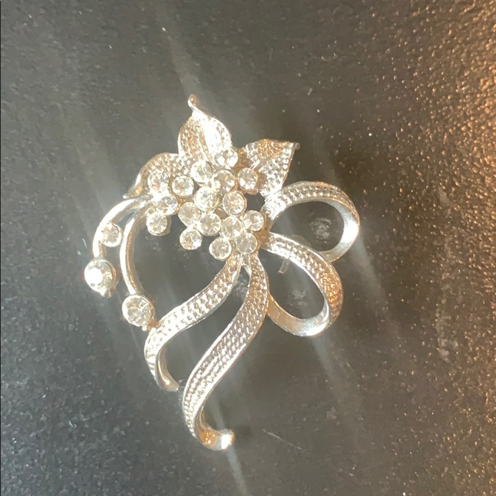Silver brooch with stones